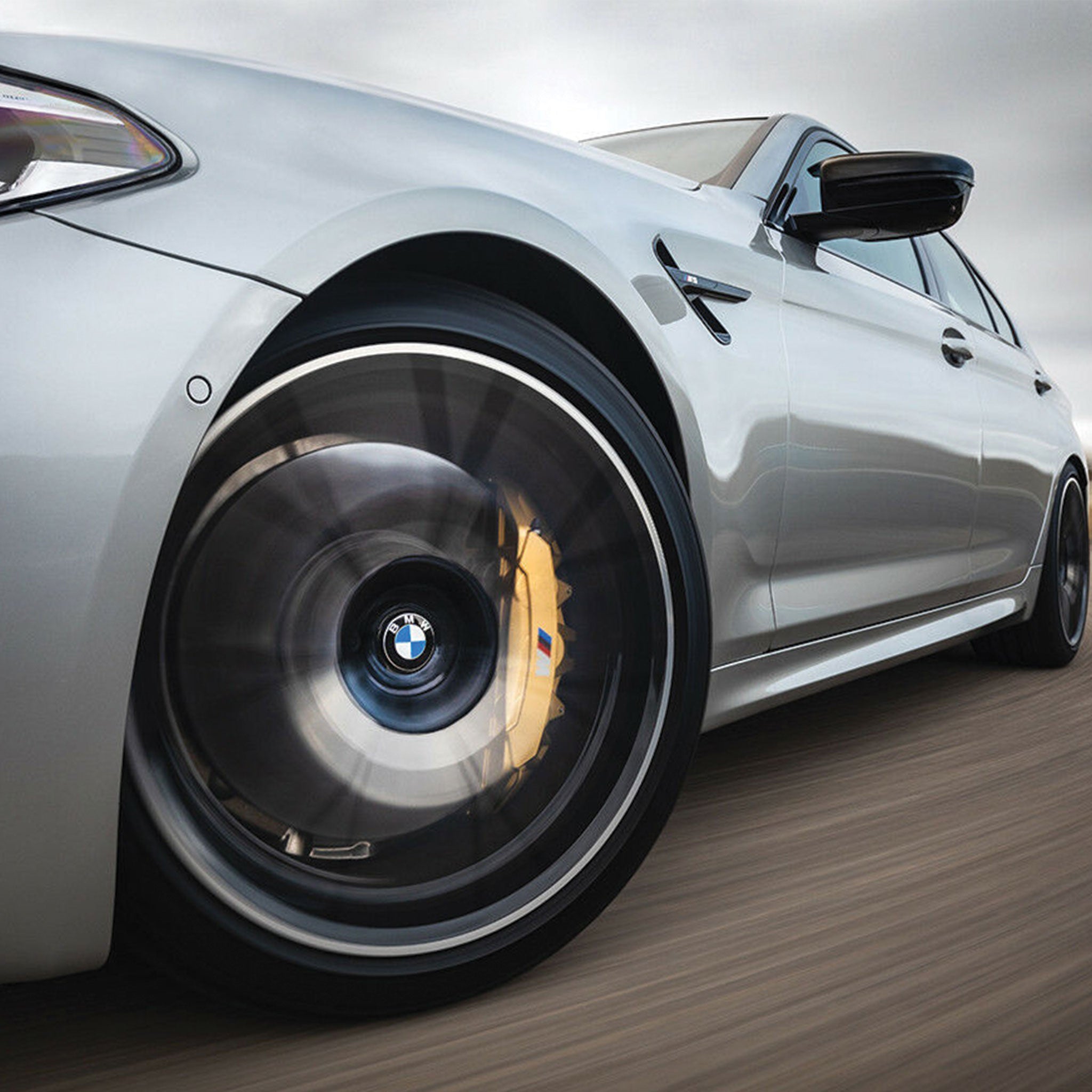 Car driving with BMW floating centre cap fitted