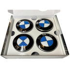 Open box with 4 BMW floating wheelcaps inside