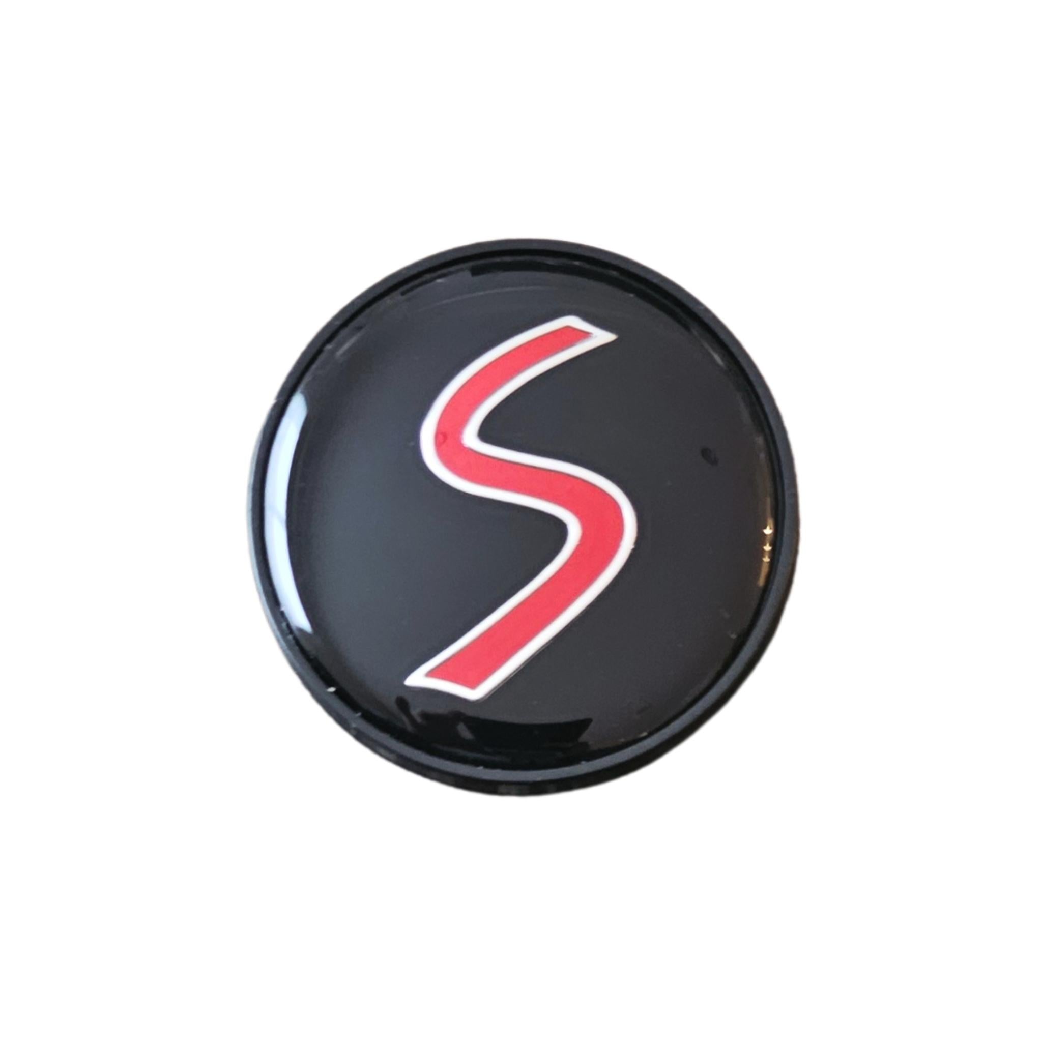 Single MINI cooper 54mm red 'S' logo wheelcaps on a white background