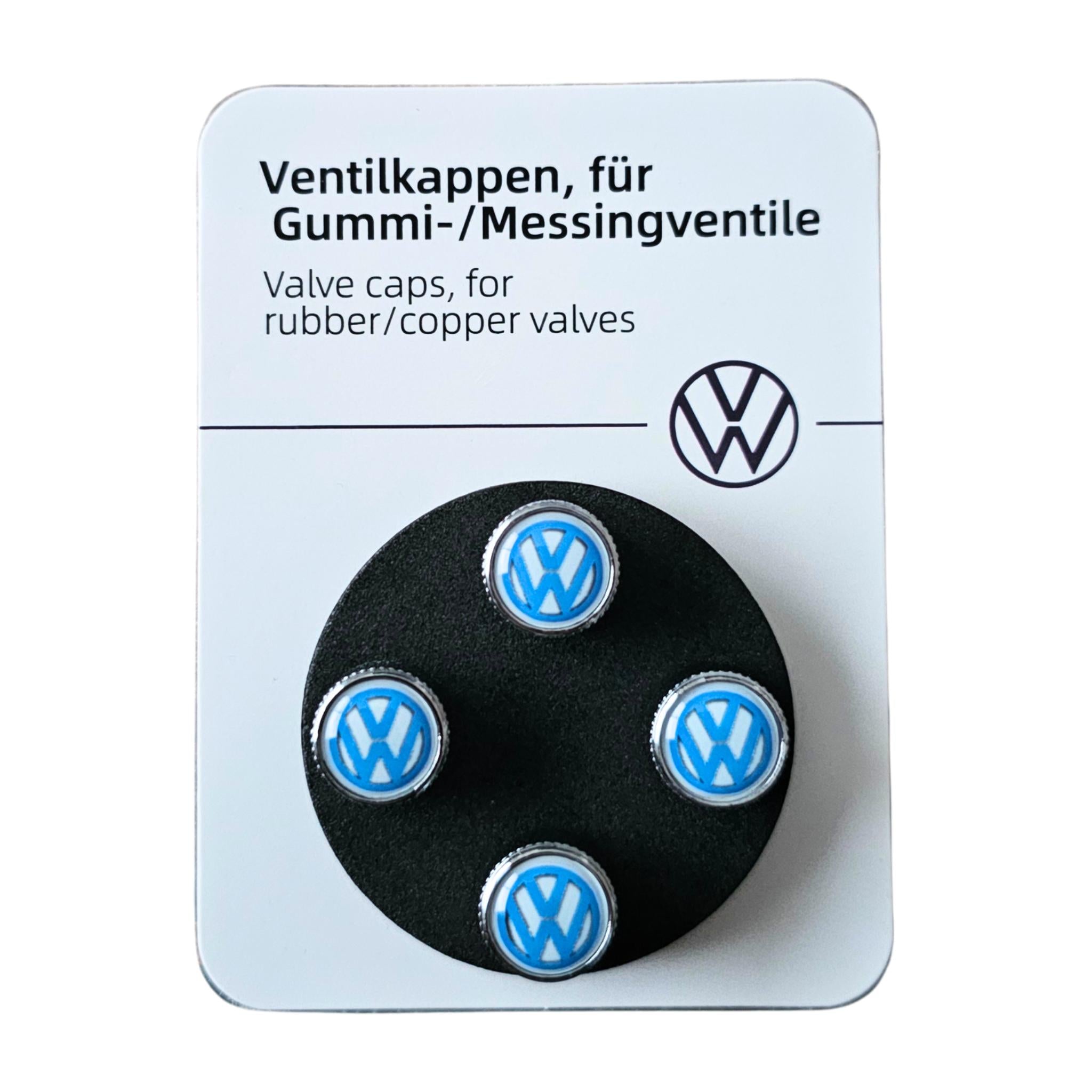 VW Volkswagen tyre valve caps on a branded card with text in German.