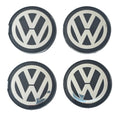Four 63mm VW Volkswagen logo wheel center caps on a white background