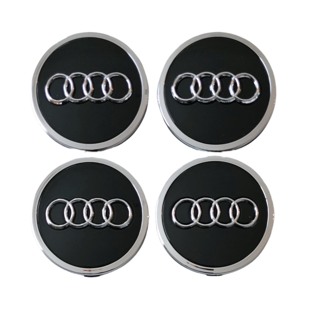 Four Audi 61mm black wheel centre caps on a white background
