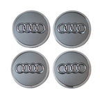 Four 61mm Silver Grey Audi Wheelcaps on a white background