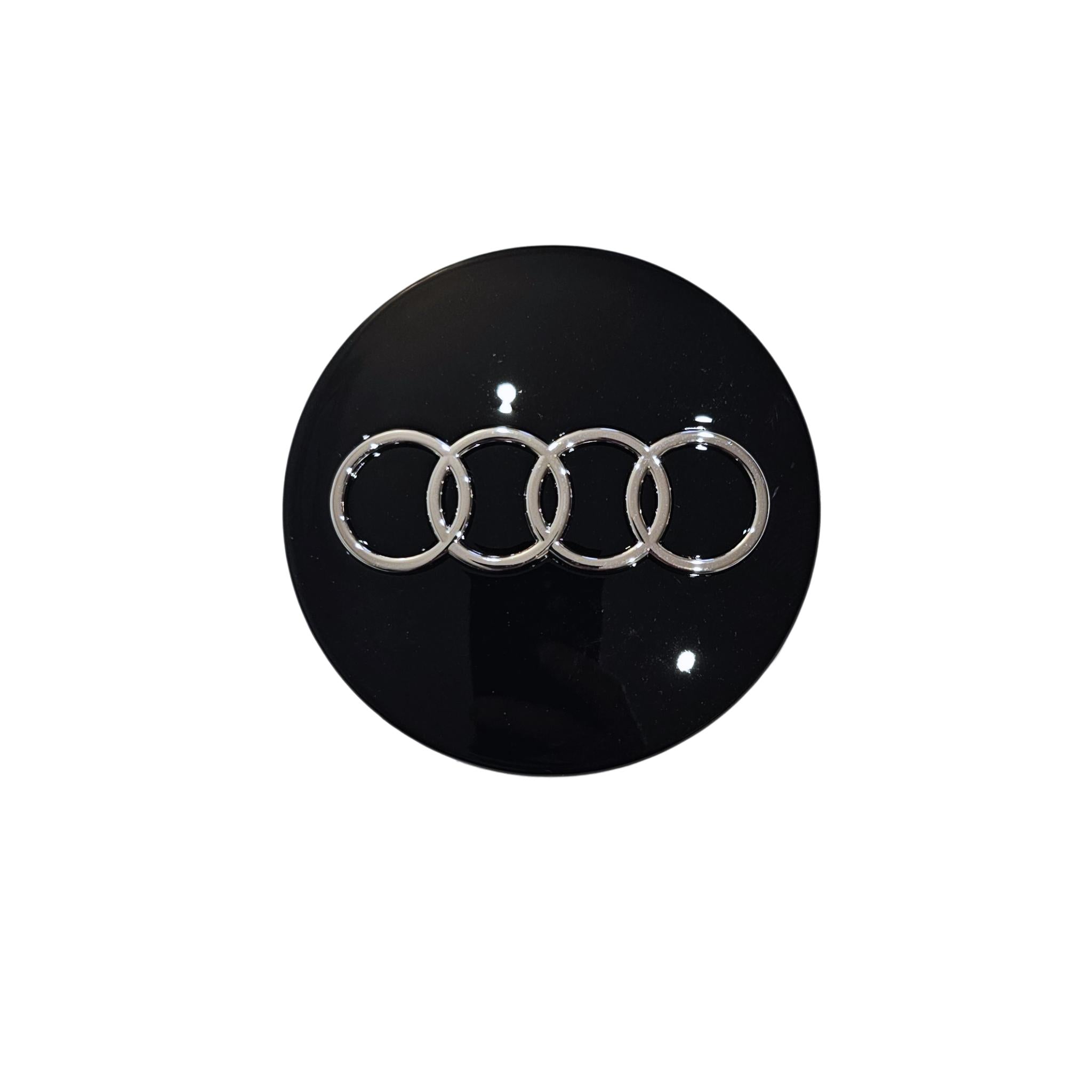 Single black Audi 68mm wheel centre caps with silver Audi logo on a white background