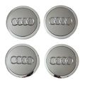 Four Silver Grey Audi logo car wheel center caps on a white background