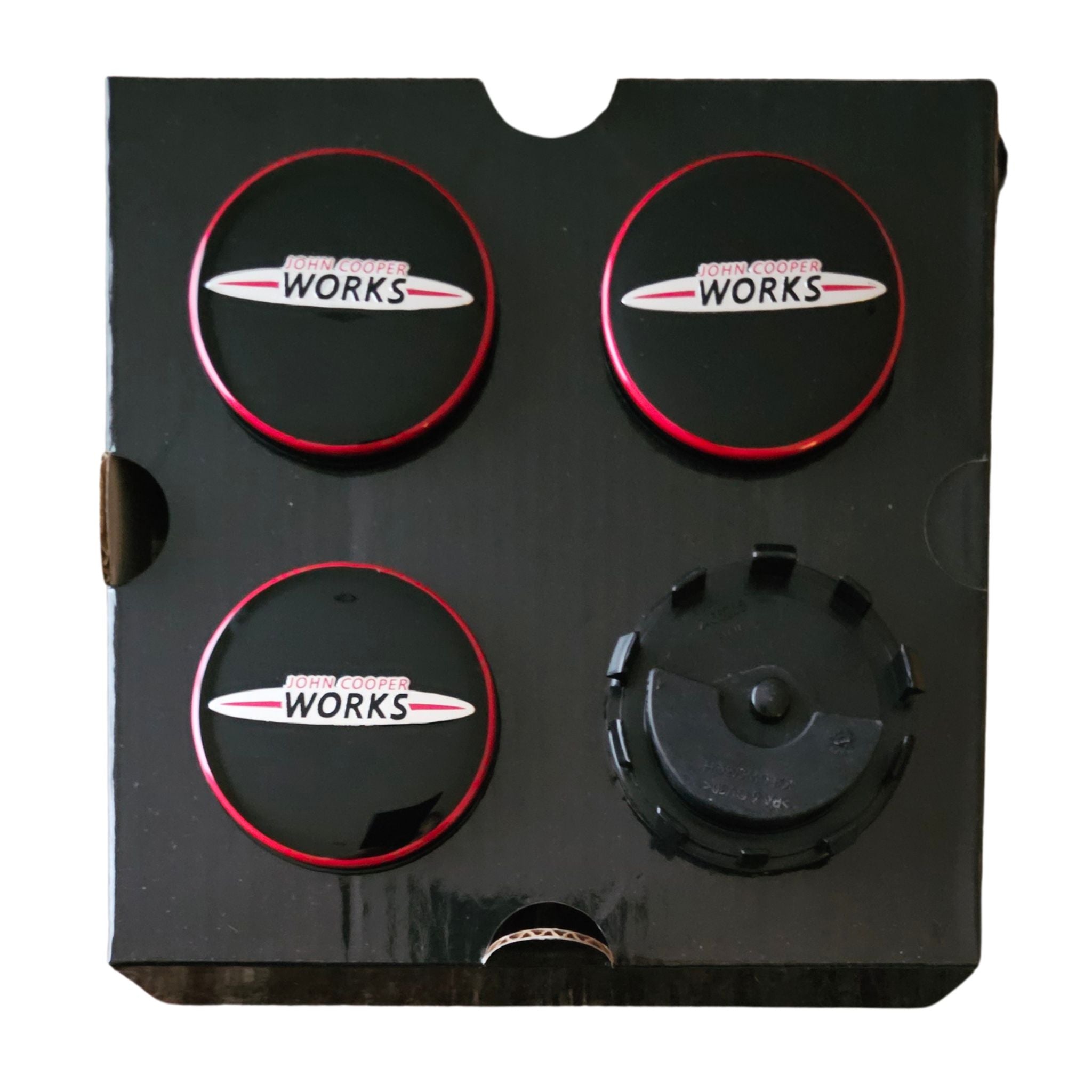 Four MINI John Cooper Works JCW Floating Wheel Centre Caps 56mm on flipped showing rear side on a white background