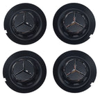 Four Mercedes-Benz  147mm Wheel centre hubcaps with on a white background