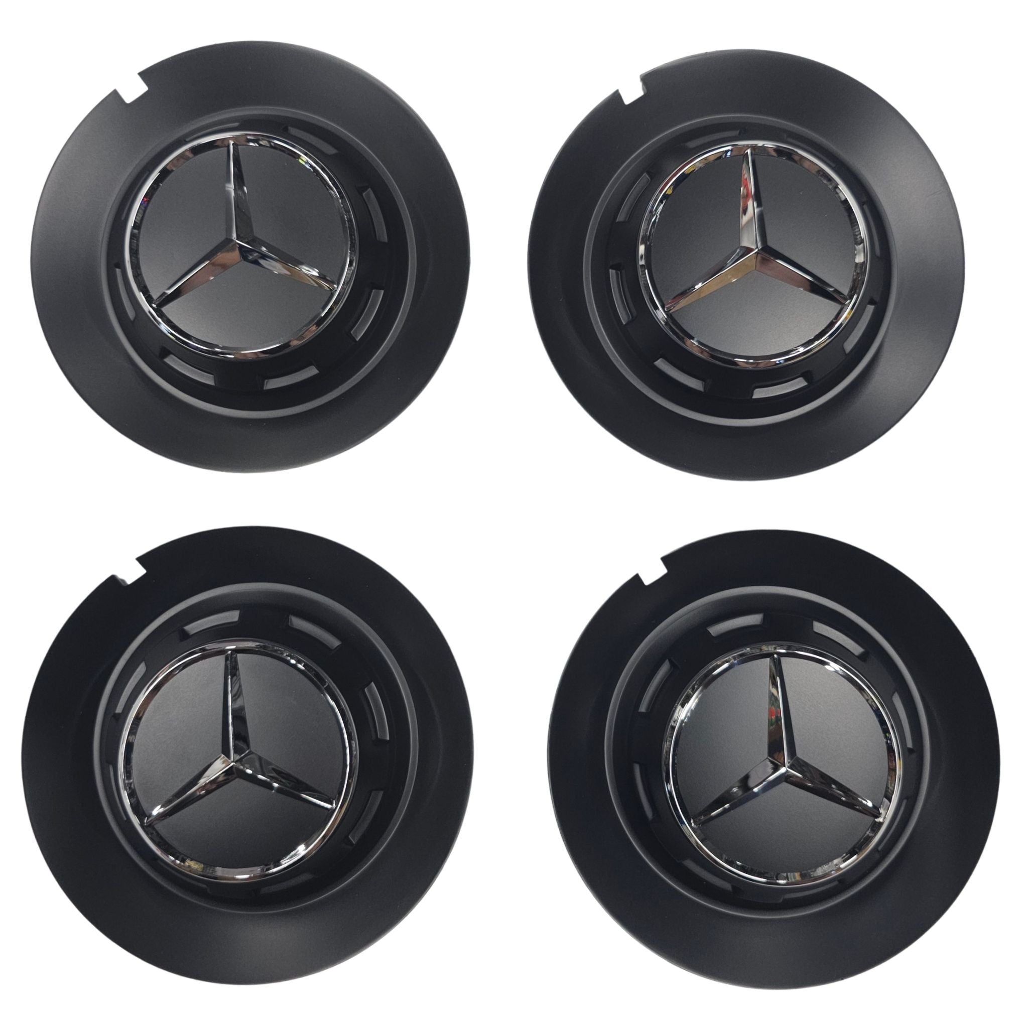 Four black Mercedes 147mm wheel center caps with emblem on a white background