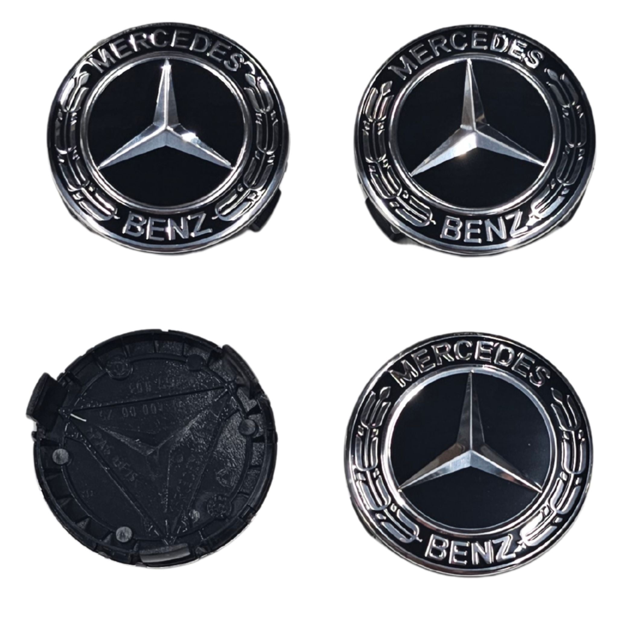 Four Black Mercedes-Benz Wheel Centre Cap emblems on a white background one flipped to show rear