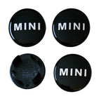 MINI 54mm Text Logo Wheel Centre Caps Gloss Black Set of 4 on a white background