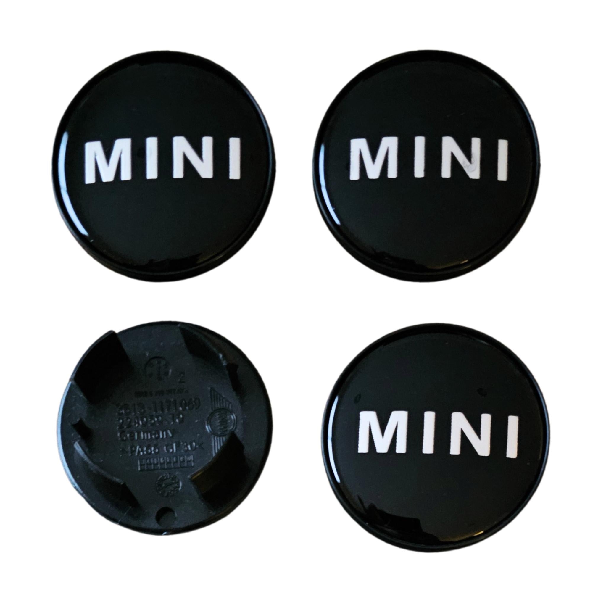 MINI 54mm Text Logo Wheel Centre Caps Gloss Black Set of 4 on a white background