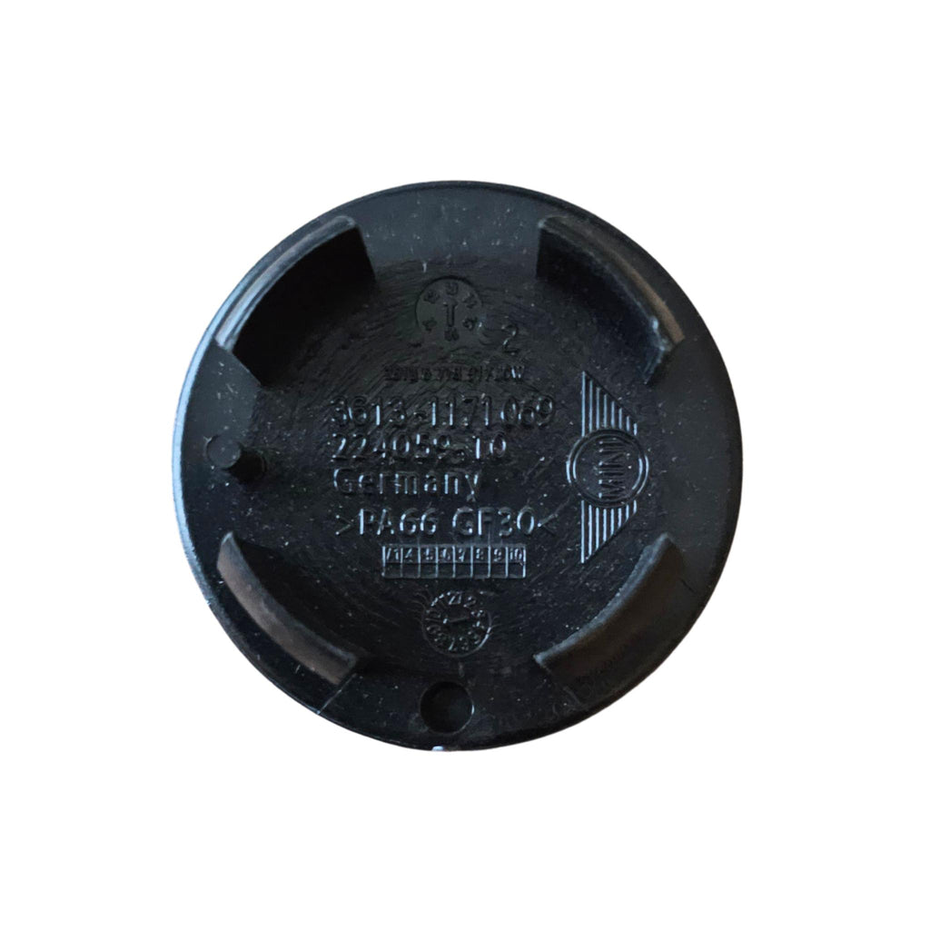 Rear of MINI 54mm Text Logo Wheel Centre Cap on a white background