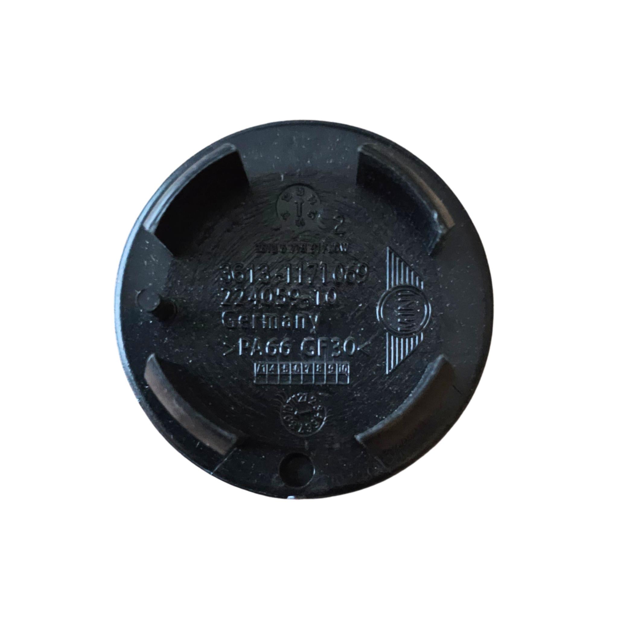 Rear of MINI 54mm Text Logo Wheel Centre Cap on a white background