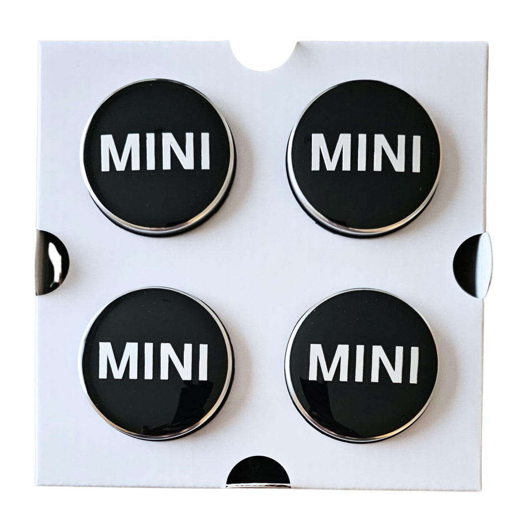Four MINI 56mm Dynamic Floating Wheel Centre Caps on white backing card