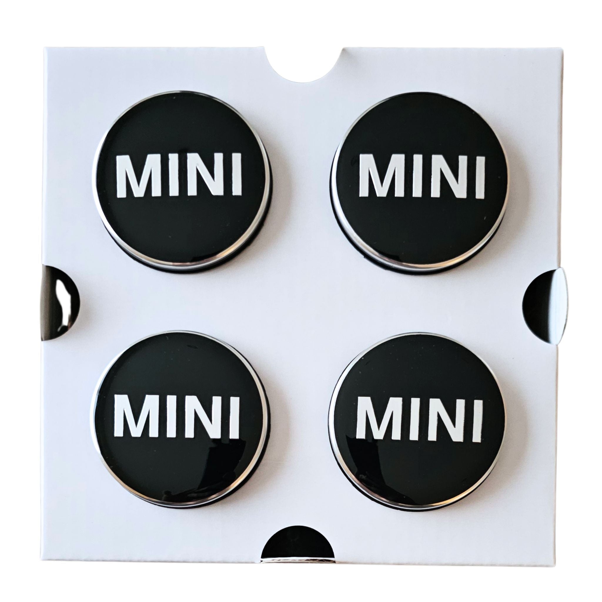 Four MINI 56mm Dynamic Floating Wheel Centre Caps on white backing card