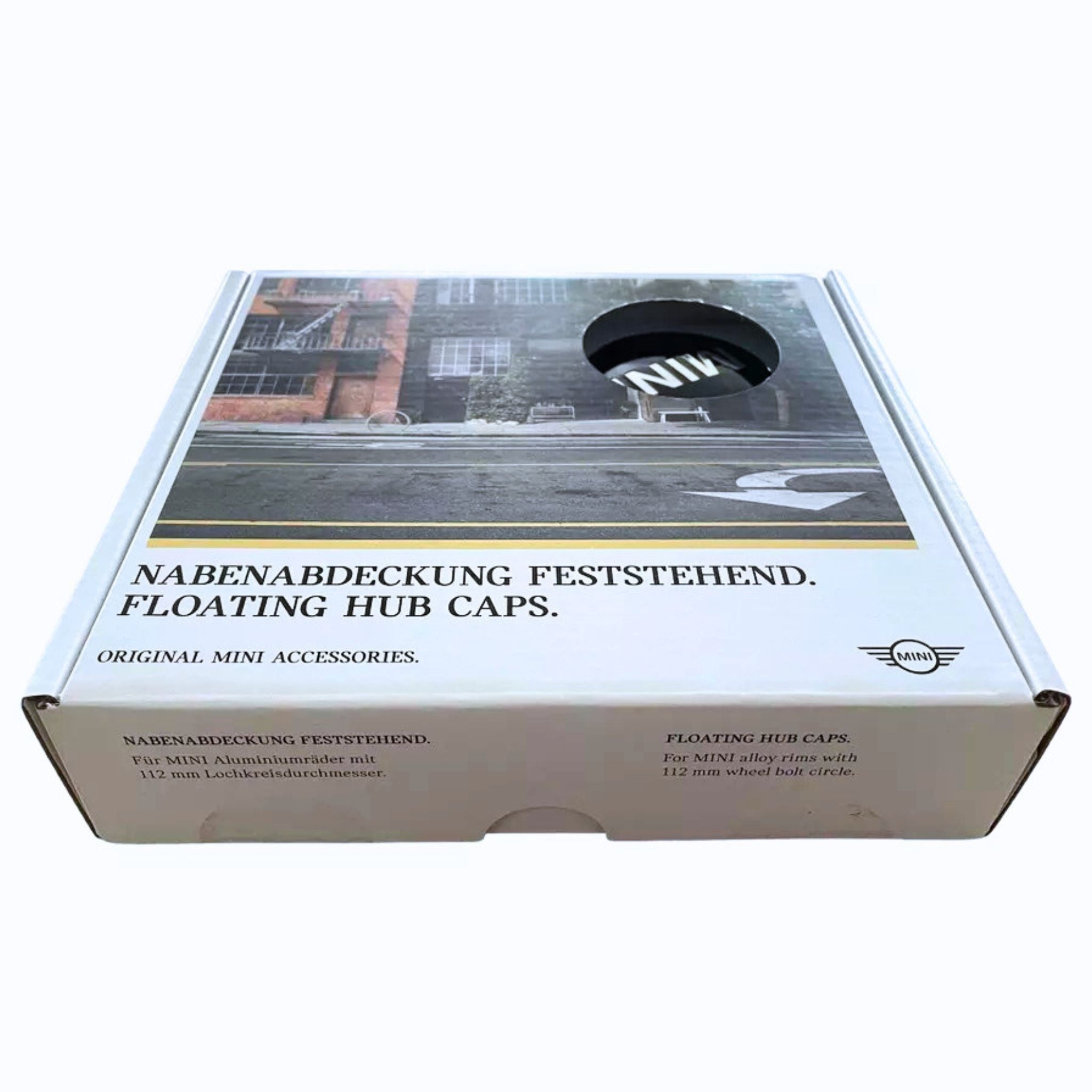 White cardboard packaging box for Mini dynamic floating 56mm wheel centre caps on a white background