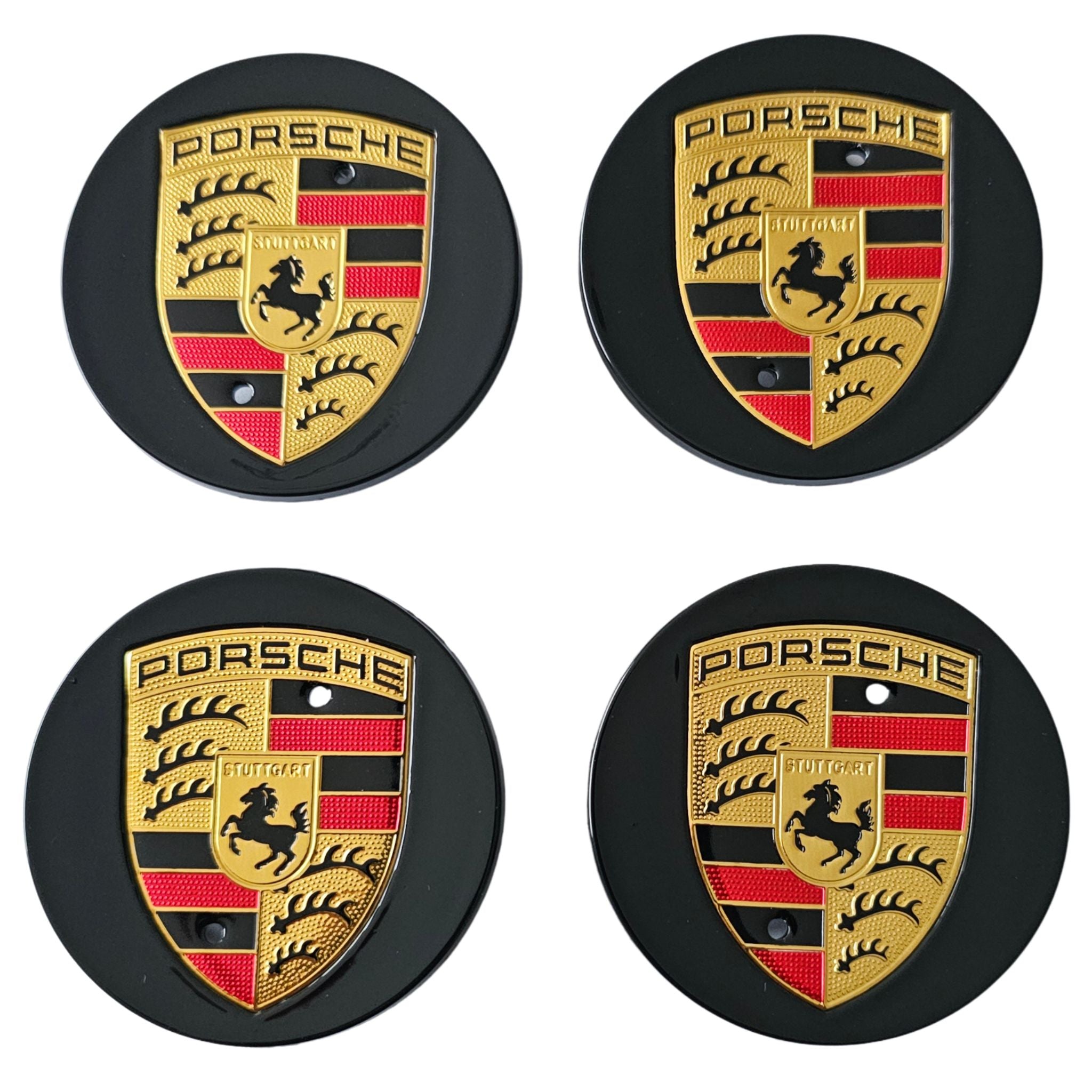 Four Black Porsche 76mm Wheel Centre Caps on white background