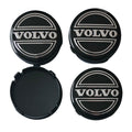 Four Volvo 64mm Classic Logo Black Wheel Centre Caps on a white background