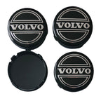 Four Volvo 64mm Classic Logo Black Wheel Centre Caps on a white background