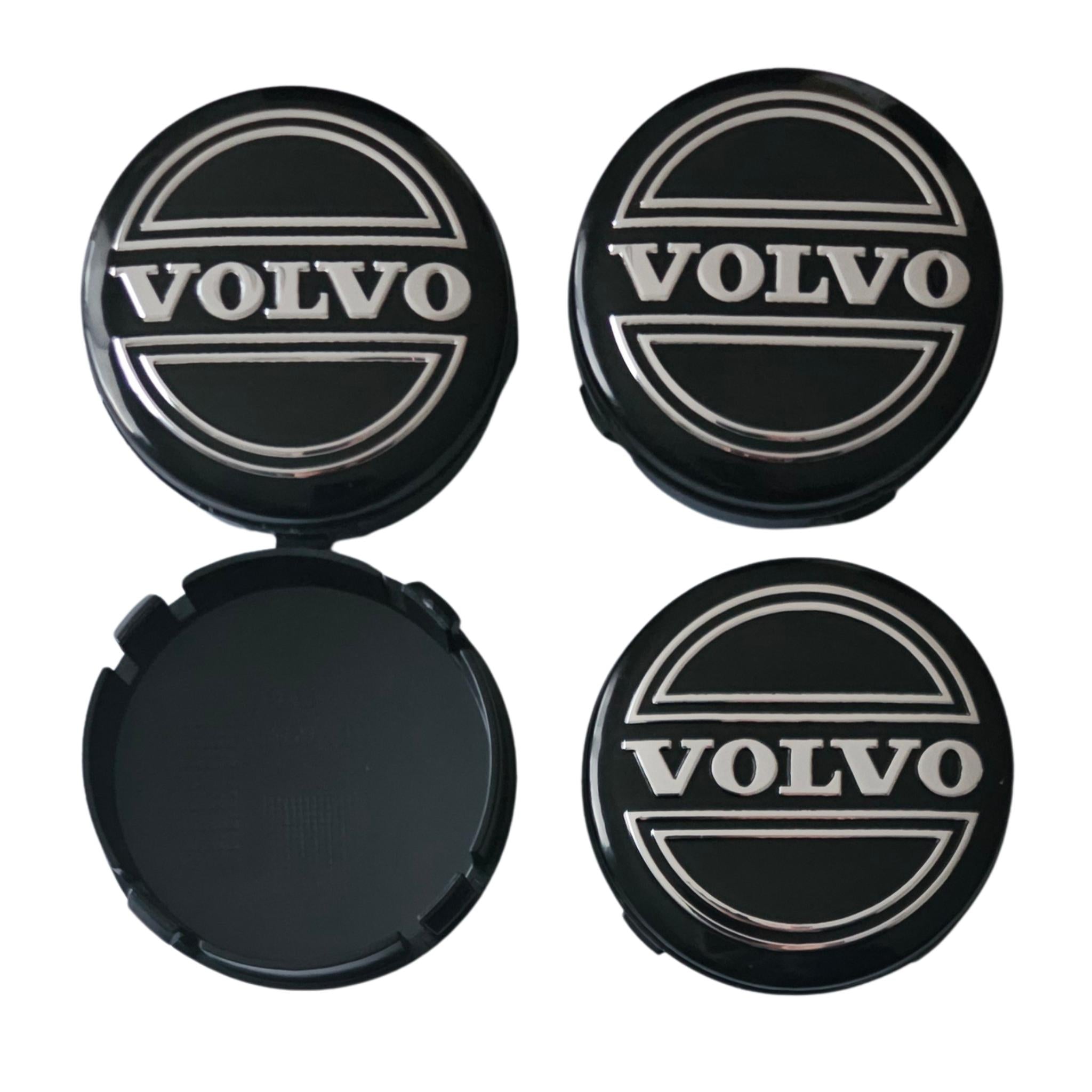 Four Volvo 64mm Classic Logo Black Wheel Centre Caps on a white background