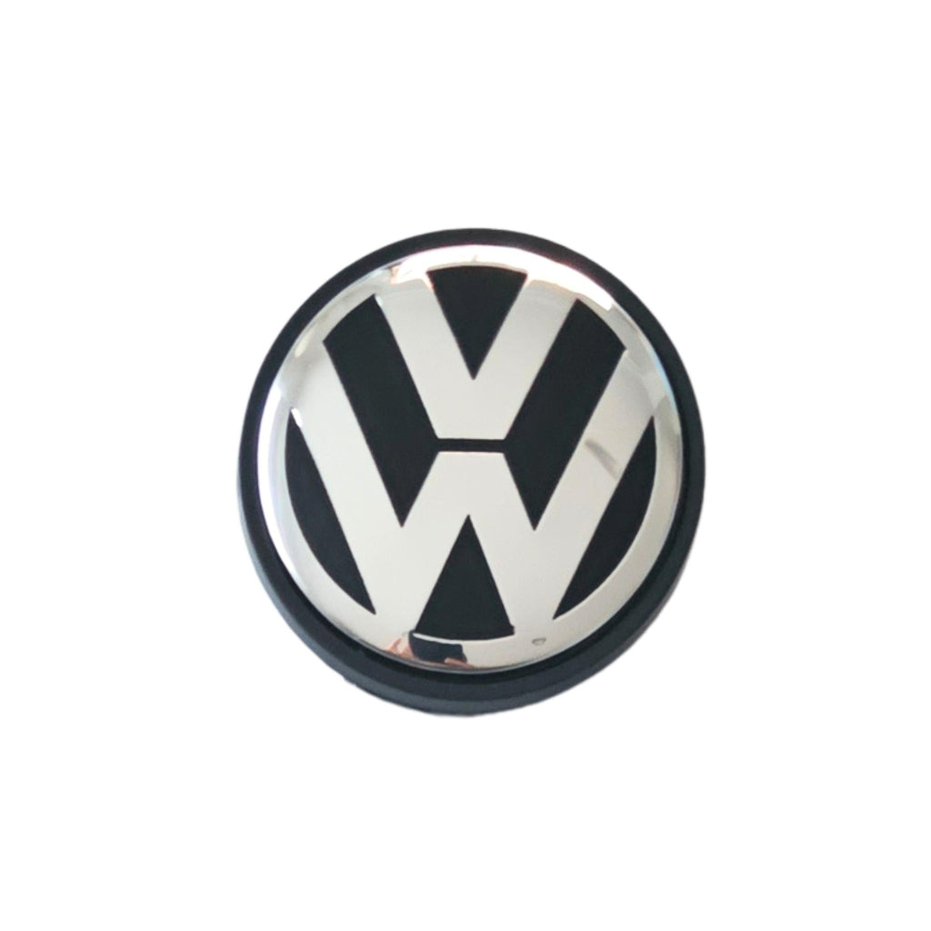 Single Volkswagen 56mm wheel centre cap with VW logo on a white background