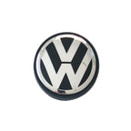 Single Volkswagen 56mm wheel centre cap with VW logo on a white background