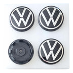 Four 65mm Floating Dynamic Volkswagen logo car wheel center caps on a white background