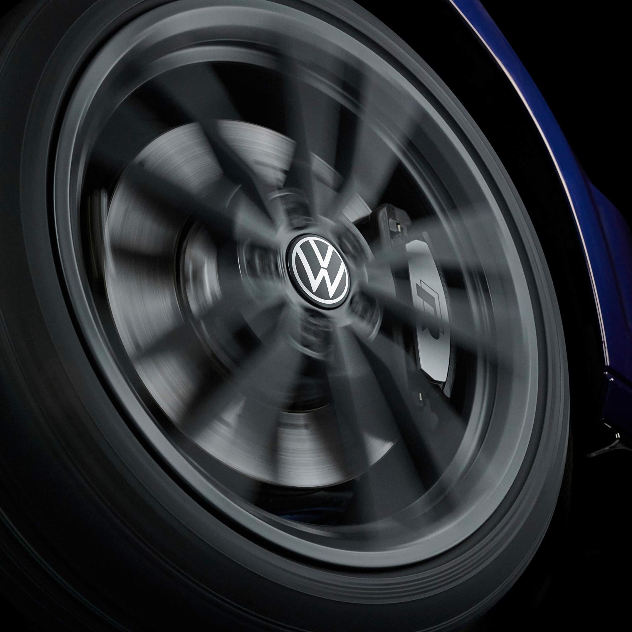 Close-up of a wheel with VW Volkswagen dynamic wheel centre cap fitted blurred  in motion effect
