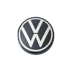 Single VW dynamic self levelling wheel centre cap 65mm on white background