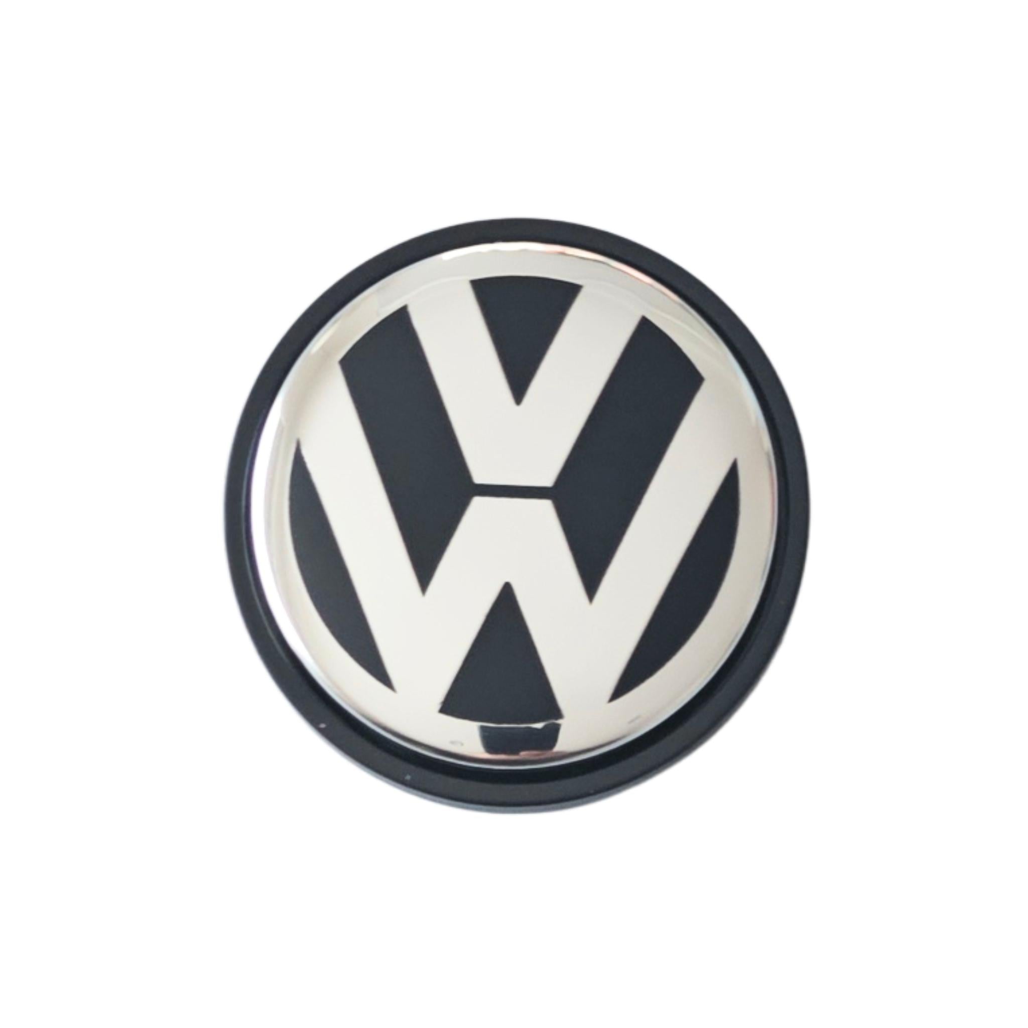 Single VW Volkswagen 65mm wheel centre cap with logo on a white background