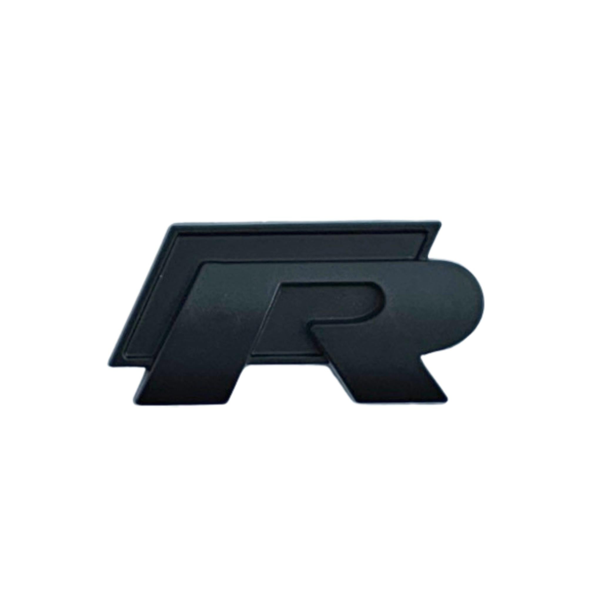 Single VW Volkswagen Golf black 'R'  Badge with adhesive back on a white background