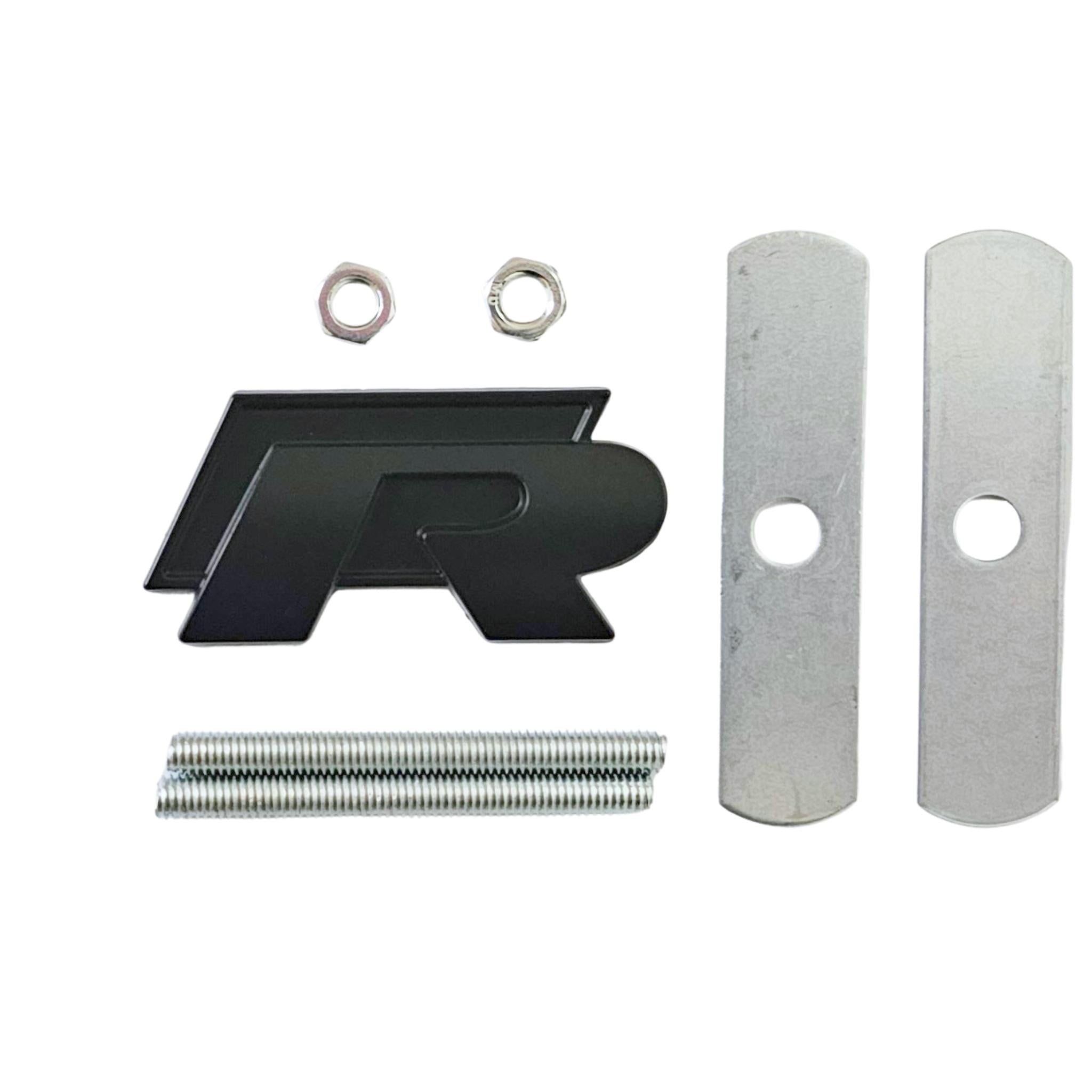 Single VW Volkswagen Golf black 'R'  Badgewith grill mounting back on a white background